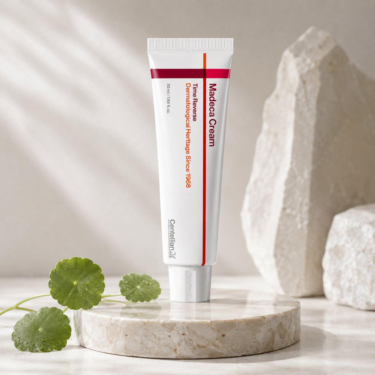 Tube of Caudwell's Medical Cream on a marble platform with green leaves and stones in the background
