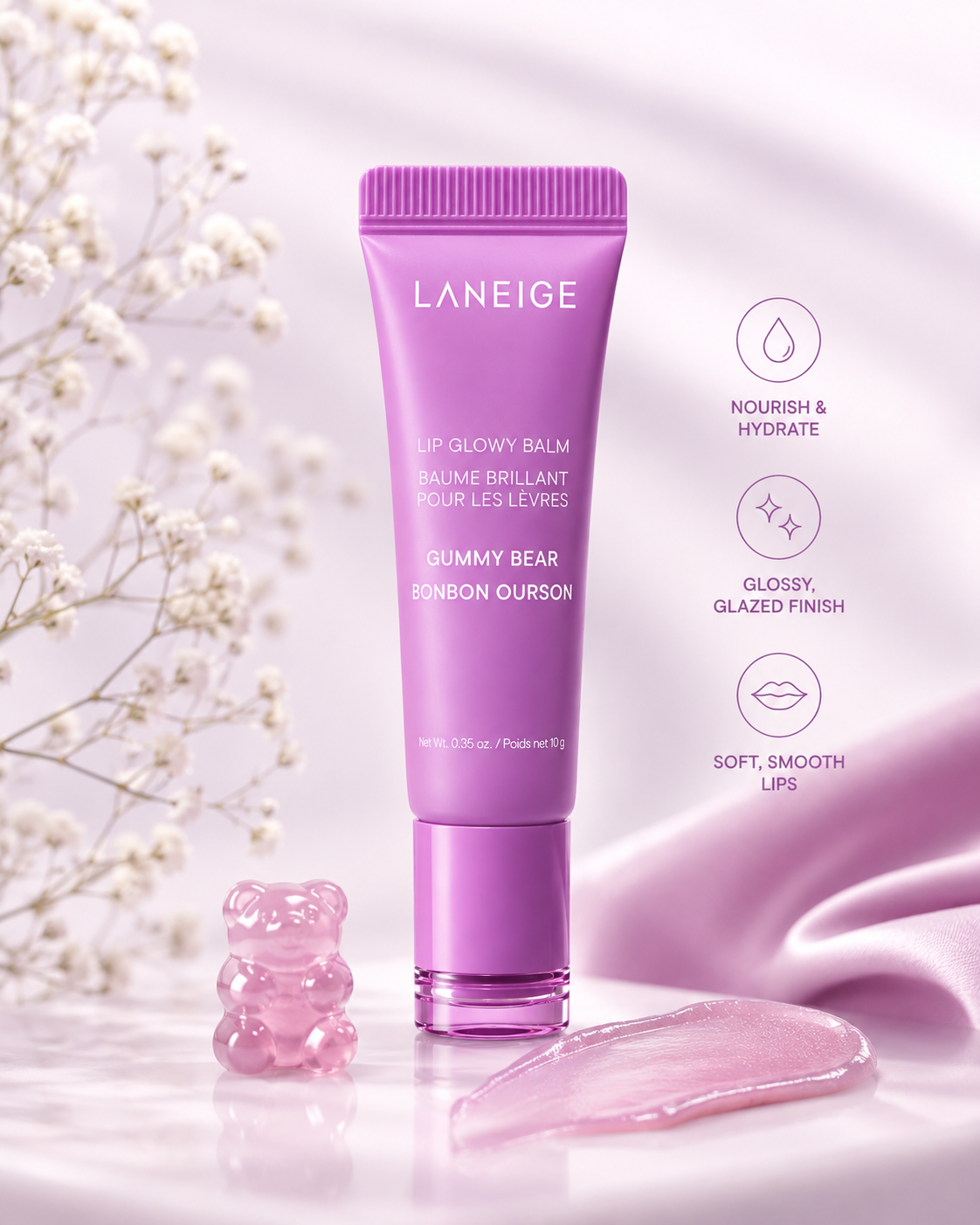 Laneige Lip Glowy Balm Gummy Bear displayed in a soft pastel setting with a gummy bear accent and silky textures, highlighting its moisturizing and glossy formula. This nourishing Korean lip balm deeply hydrates dry lips, enhances natural shine with a glazed finish, smooths lip texture, and keeps lips soft, supple, and healthy-looking while delivering a sweet candy-inspired scent.