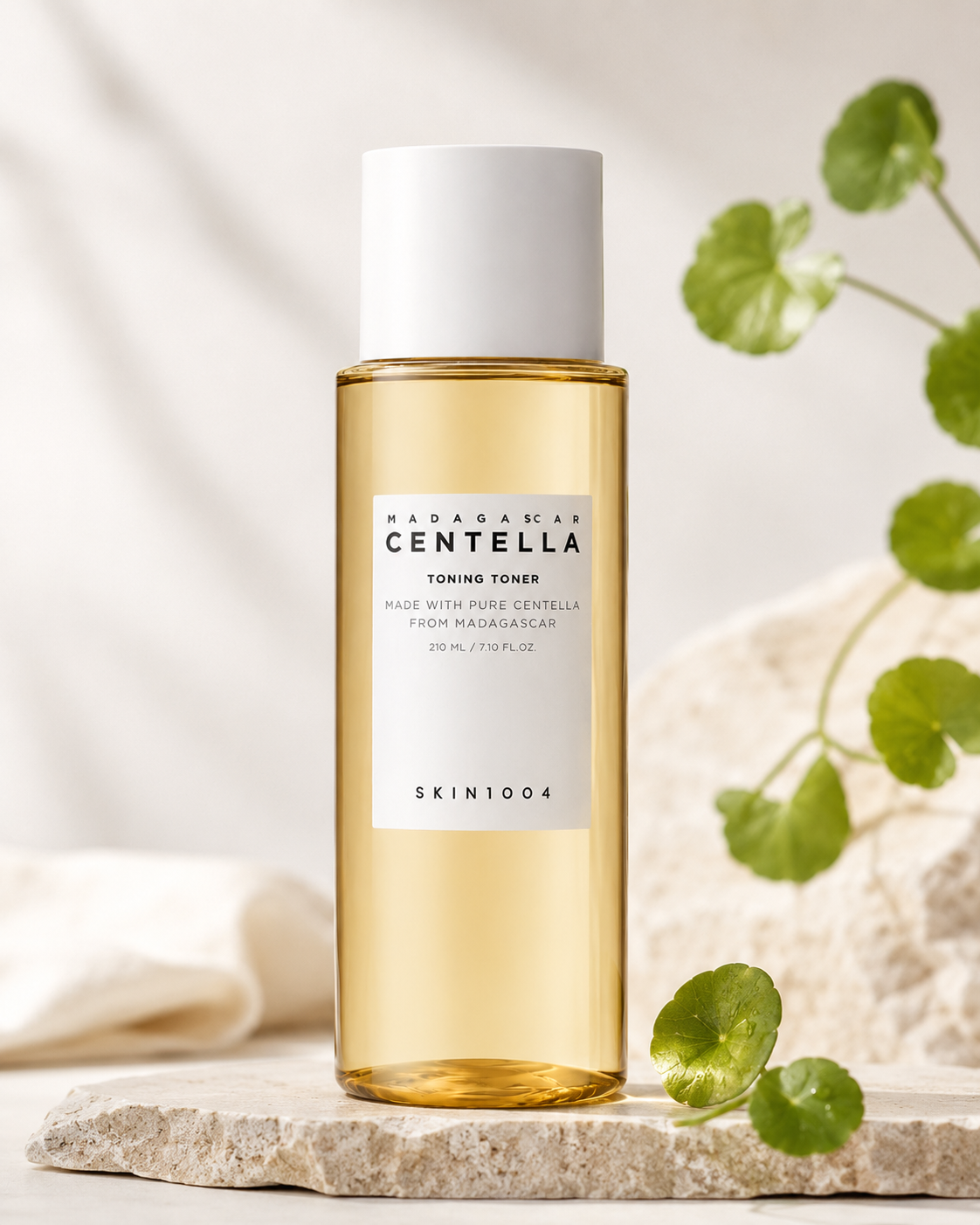 Skin1004 Madagascar Centella Toning Toner 400ml on a neutral background with greenery.